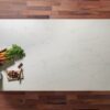 Overhead view of White Macaubus Quartz worktop showing soft grey veining across a bright surface